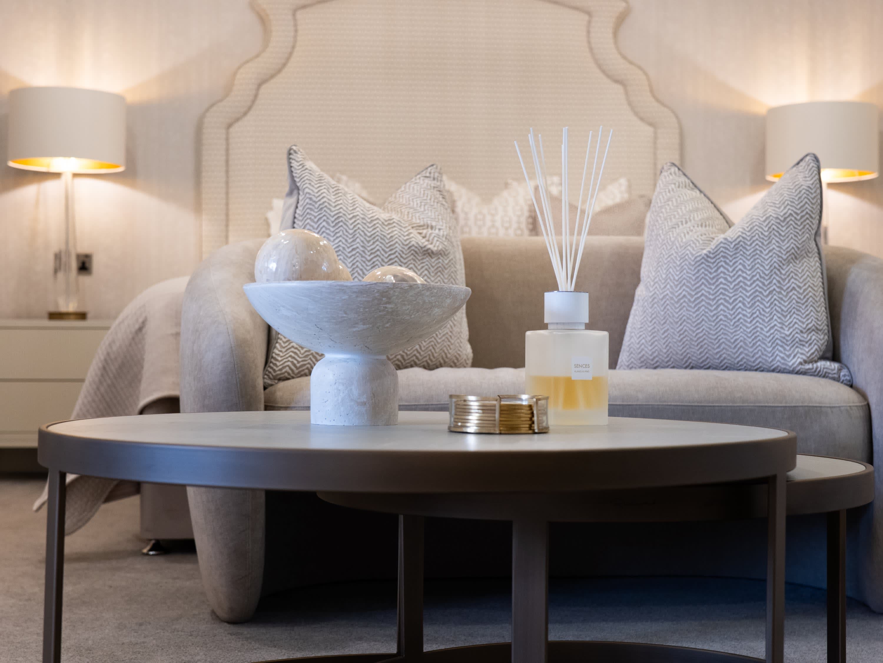 Merrydale Manor suite styling detail — coffee table with reed diffuser, marble bowl and decorative accessories