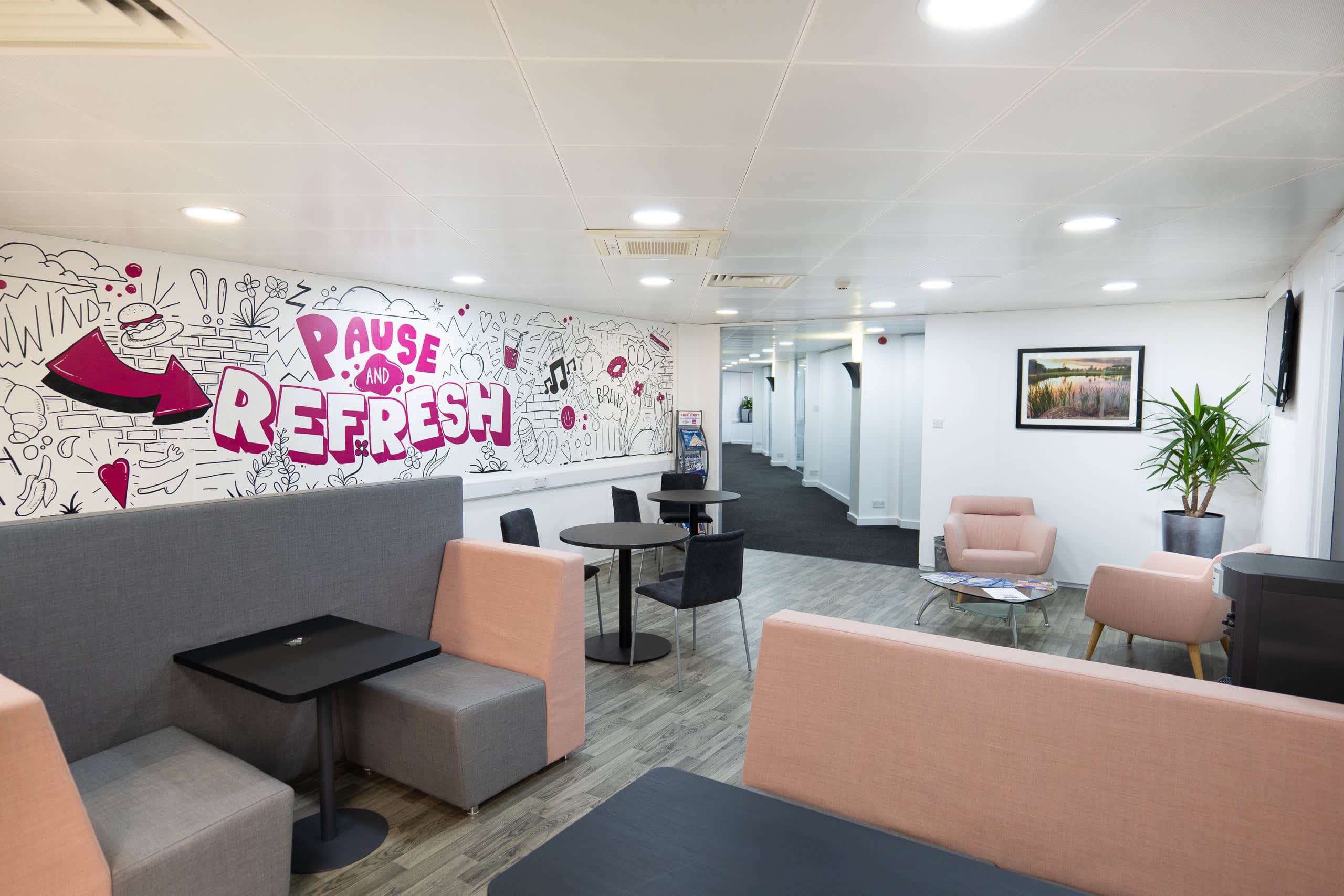 Alternate view of the PAUSE AND REFRESH mural and communal seating area at Genesis Centre, Birchwood Warrington