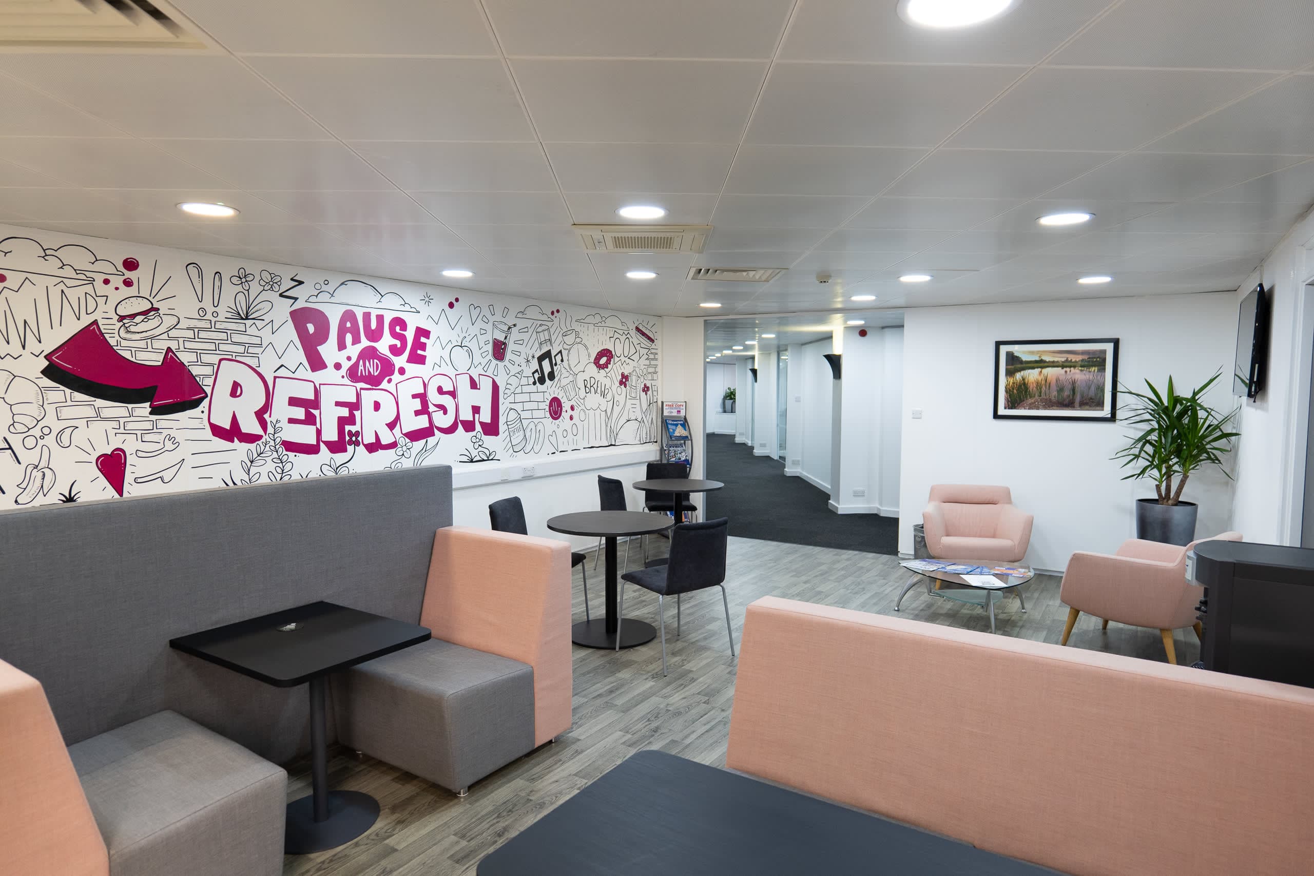 PAUSE AND REFRESH graffiti-style mural in the Genesis Centre communal breakout area, Birchwood Warrington