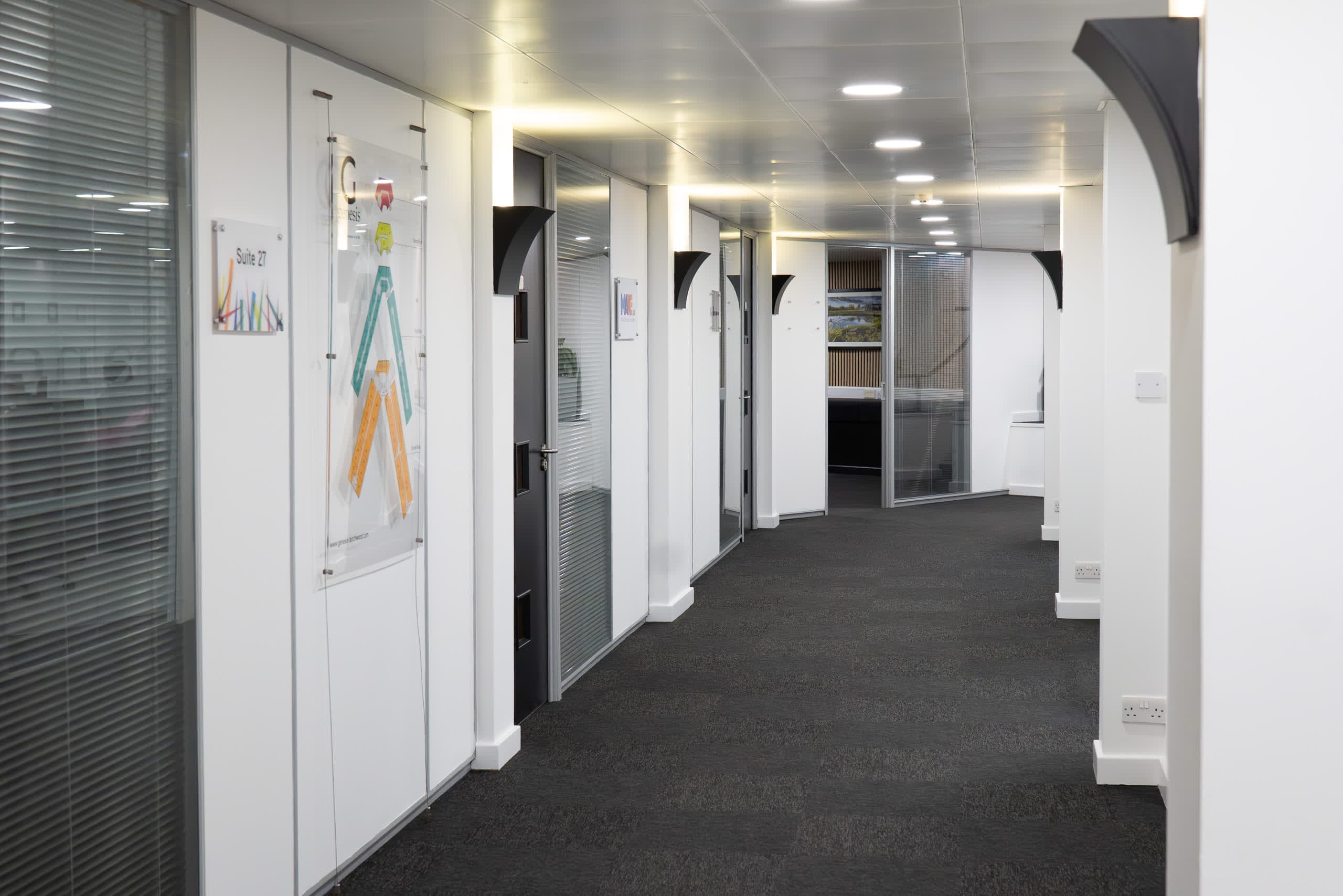 Professional office suite entrance doors along the main corridor at Genesis Centre, Birchwood Warrington