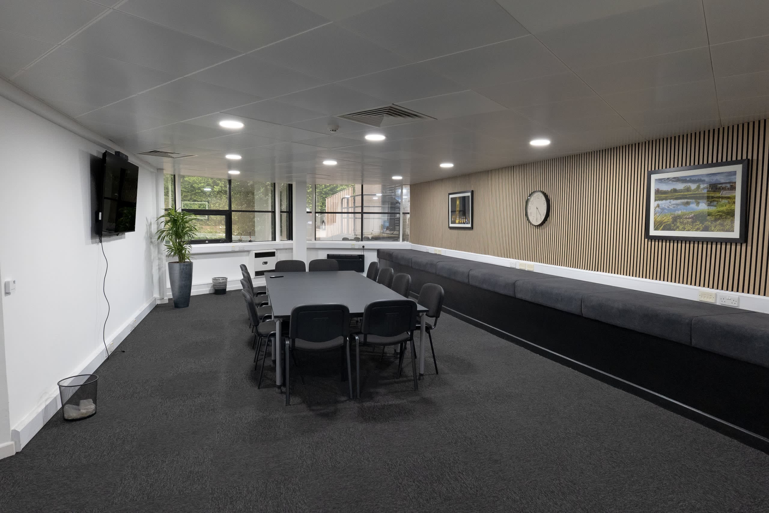 Alternate perspective of Genesis Centre meeting room showing full layout and natural light, Birchwood Warrington