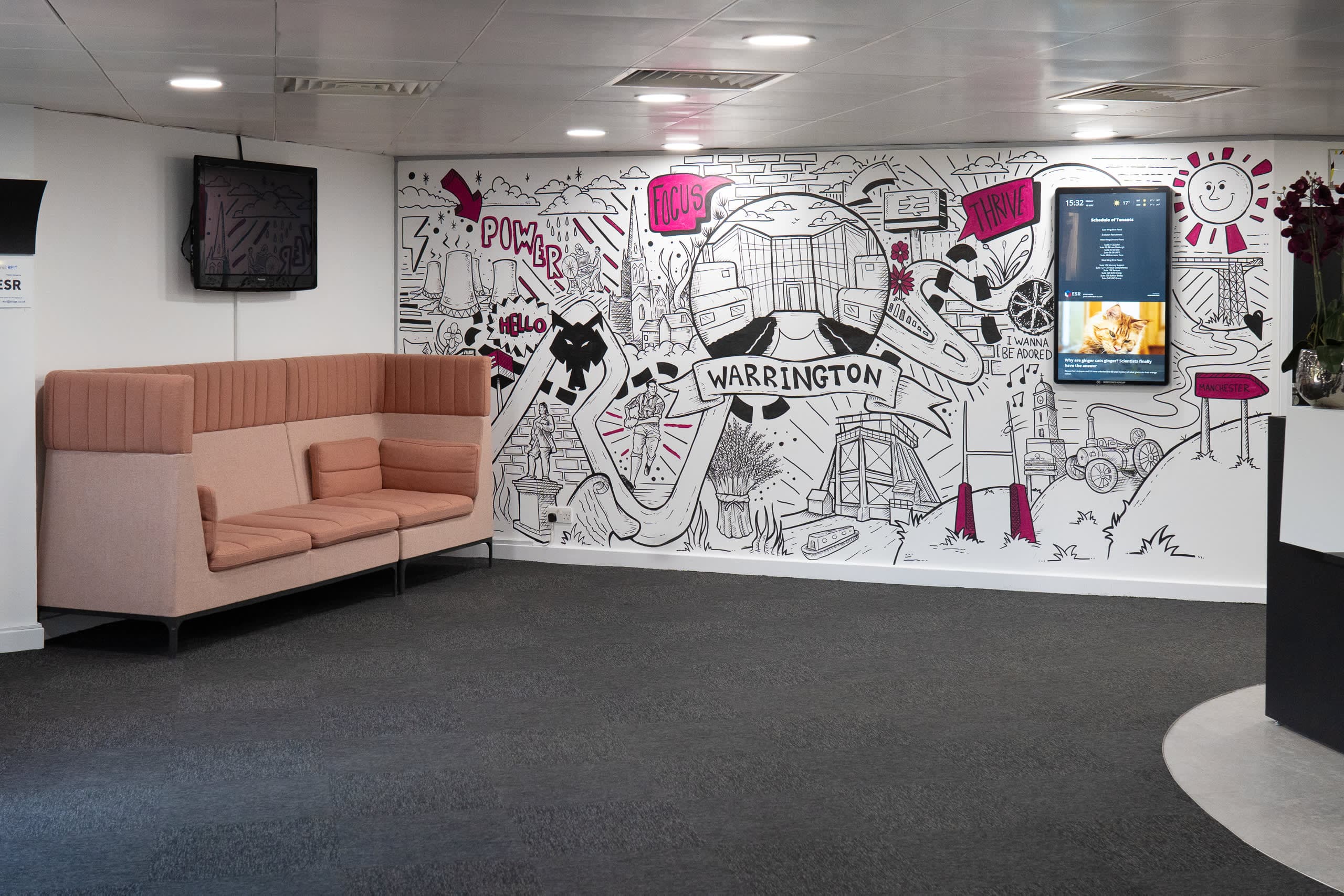 Reception lounge at Genesis Centre featuring THIS IS BIRCHWOOD WARRINGTON custom graffiti mural, Birchwood Warrington