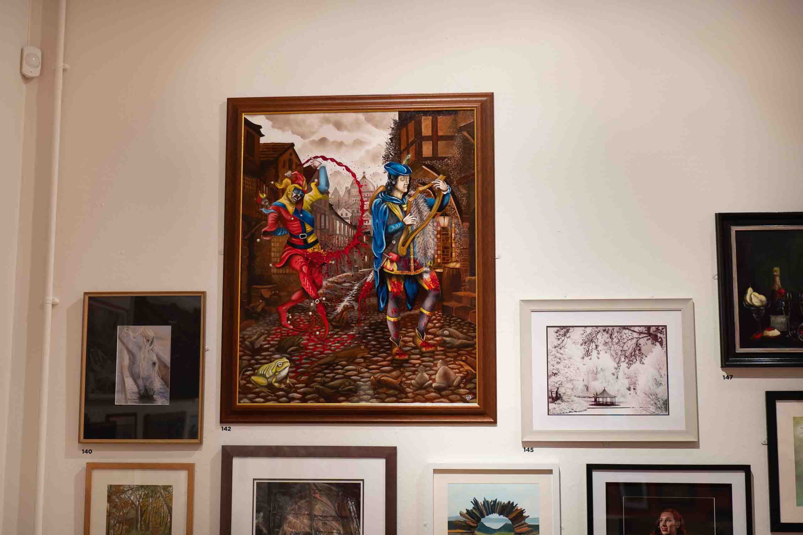 Harris Museum Open Exhibition 2026 — detailed oil painting of two harlequin and jester figures in a historical cobbled street scene