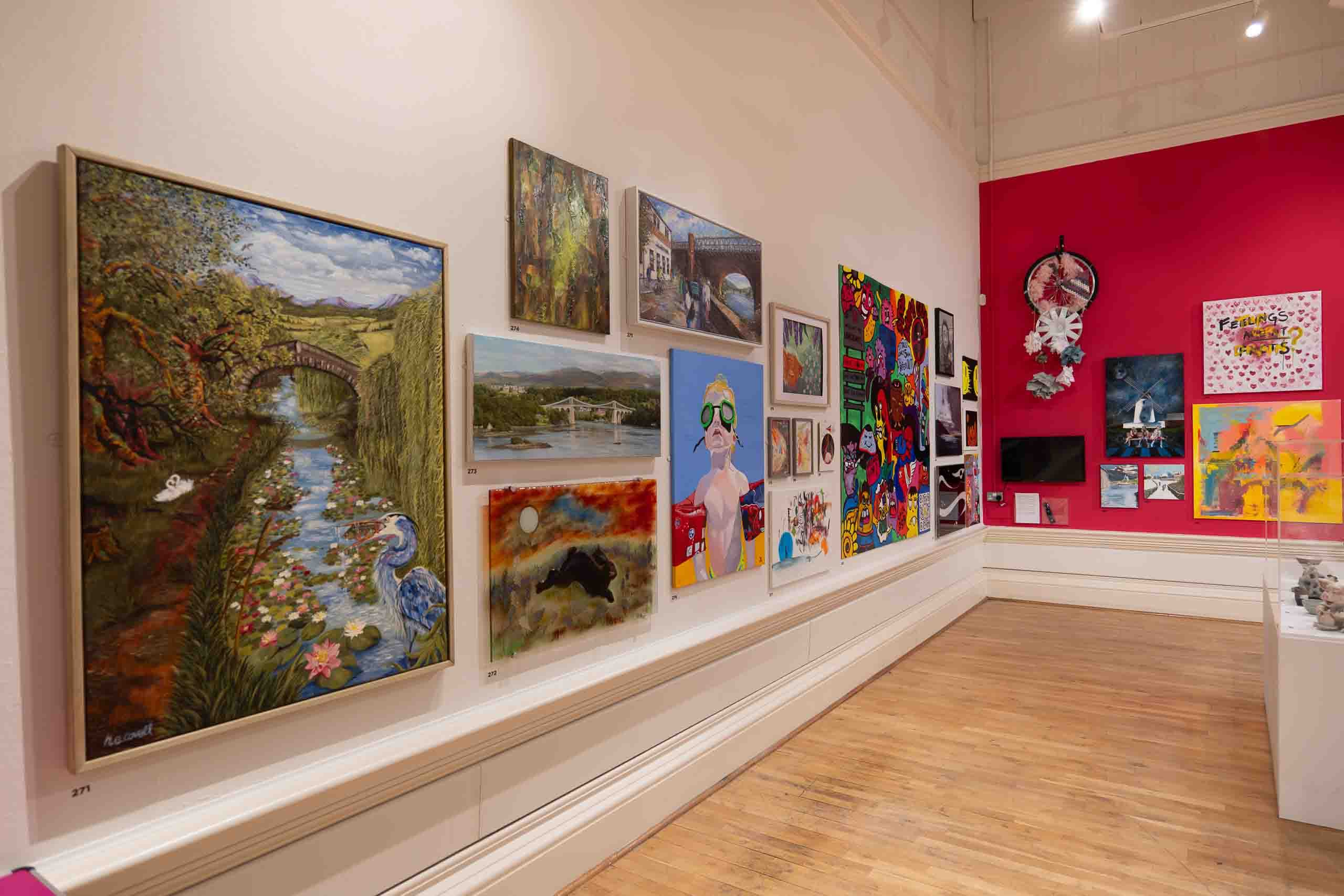 Harris Museum Open Exhibition 2026 — side gallery wall with large landscape oil paintings and red accent wall in background
